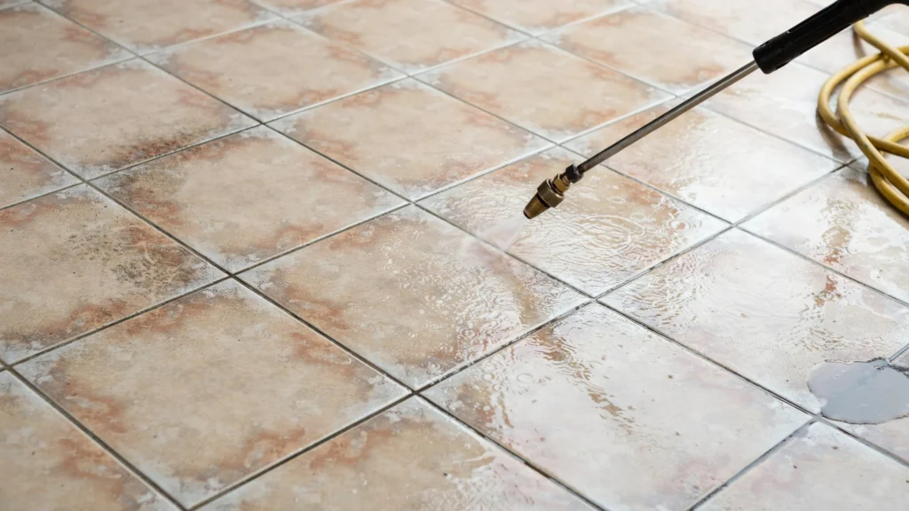Can you pressure wash tile grout using a brass wand on terracotta floor tiles